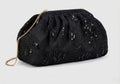 Chloé Millaut - Håndholdt sort clutch i stof prydet med blomsterprint og palietter